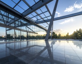 Modern architectural framework with glass and steel structure, glass facade with a greed of steel