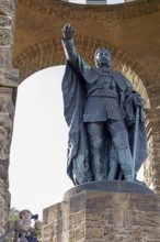 Woman photographed, statue, Kaiser Wilhelm Memorial, Porta Westfalica, North Rhine-Westphalia,