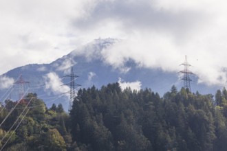 Patscherkofel mountain with power poles in autumn, Innsbruck, Tyrol, Austria