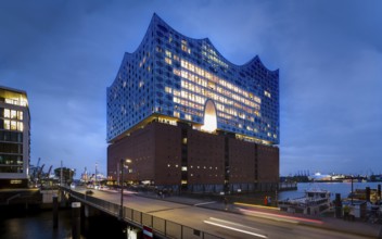 Elbe Philharmonic Hall at the Blue Hour with light strips of vehicles in the foreground and light