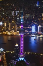 Aerial view over The Bund, Huangpu River and Lujiazui financial district with illuminated