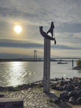 Photo with melancholy atmosphere of sculpture Fährmann Artwork on pillar stele by sculptor Dieter