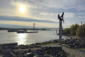 Photo with melancholy atmosphere of sculpture Fährmann Artwork on column stele by sculptor Dieter