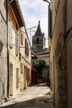 Alley and church tower, Arles, France