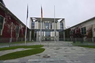 The Federal Chancellery, contemporary government complex with strict symmetry and empty forecourt,