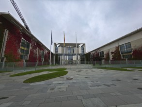 The Federal Chancellery, modern government building with glass and red climbing plants on a silent,