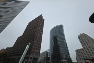 Wide-angle view of the skyscrapers on Potsdamer Platz under a cloudy sky, at Potsdamer Platz in