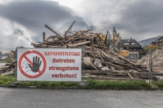 Large construction site banner, entry into danger zone strictly prohibited! Demolition of a