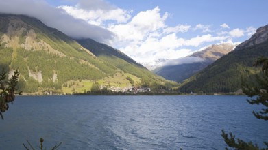 View over Lake Reschen to the village of Graun in Vinschgau, which is beautifully situated in the