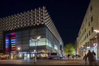 Prager Straße in the evening with the Centrum Gallery with police patrol, Dresden, Saxony, Germany
