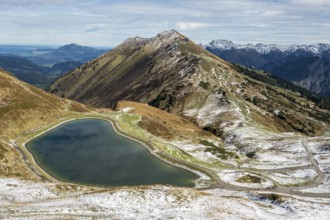 Reservoir, Kanzelwand snow-making pond, behind Fellhorn and mountains of the Allgäu Alps,