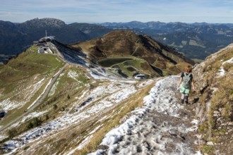 Female hiker on hiking trail below the Kanzelwand, back left Kanzelwandbahn mountain station,