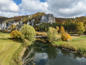Aerial view of the Upper Danube Valley near Thiergarten surrounded by autumn vegetation with raven