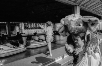Germany, Berlin, 01.8.1992, hustle and bustle on Marx-Engels-Platz, bumper car, man with caught