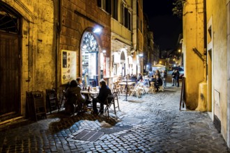 Street with bars and restaurants in Roman Ghetto (Ghetto di Roma). Rome, Province of Rome, Italy.
