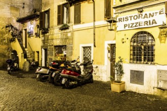 Street in Trastevere at night. Rome, Province of Rome, Italy. 25.12.2012