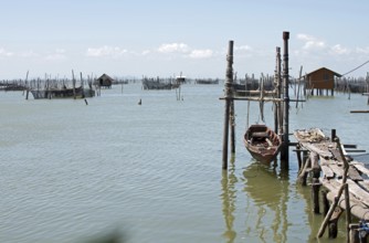 Thailand, Songkhla, Koh Yo, Aquacultural farm, Freshwater fish farming, Long-tailed boat out of