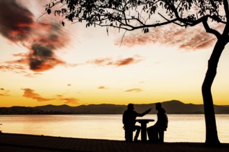 Sidewalk of Beira Mar Norte Avenue at sunset. Florianopolis, Santa Catarina, Brazil