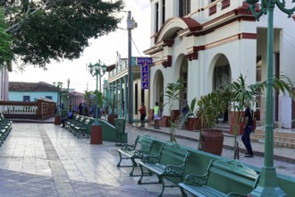 Baracoa, Cuba, Central America, well-kept square with benches and colonial buildings in the