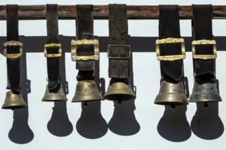 Cowbells hanging on a house wall, Schwand, Stillachtal, near Oberstdorf, Oberallgäu, Allgäu,