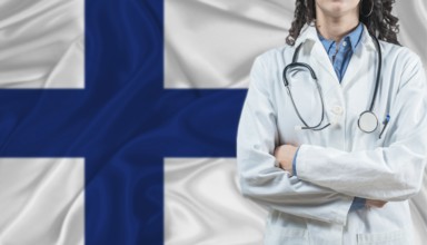 Medical professional on Finland flag. Healthcare and wellness in Finland, Concept
