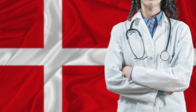 Medical professional on Denmark flag. Healthcare and wellness in Denmark, Concept