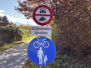 Road signs along an autumn trail that is accessible to cyclists and pedestrians, bicycle tourism,