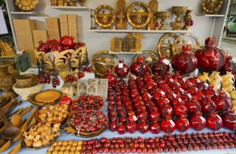 Selling red decorative pomegranate crafts on a market table, Vernissage Market, Handicraft Market,