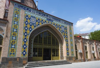 Building with intricate tile patterns and lettering on an archway, Blue Mosque, Shiite Mosque,