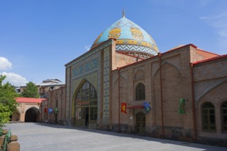 Side view of a mosque with blue dome and colorful mosaics under bright sky, Blue Mosque, Shiite