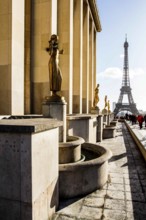 Gilded bronze statues at Palais de Chaillot and Eiffel Tower (Tour Eiffel) in the background.