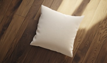 A white pillow sits on a wooden floor. The pillow is placed in the center of the image, and the