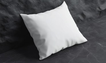 A white pillow against a dark stone surface, highlighting contrast and modern minimalism. AI