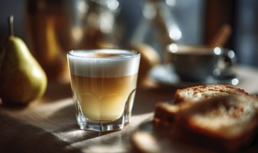 A glass of coffee sits on a table next to a plate of toast. The scene is casual and inviting, with