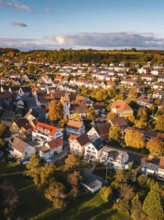 A village full of colorful roofs and autumnal opulence under blue skies, Deufringen, Aidlingen,