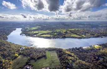 Aerial view, Lake Baldeney river Ruhr, meadows and fields and blue sky with clouds, view to the