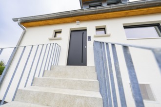 Front view of the entrance with clear lines and quiet, modern look, house renovation,