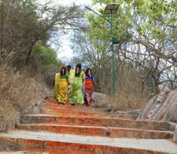 Indian pilgrims on the red steps to Chamundi Hill, Mysuru or Mysore, Karnataka, India