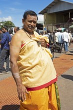 Hindu monk, 63 years old, in monk's robe, puja at the Chamundeswar Hindu temple on Chamundi Hill,