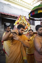 Puja at the Chamundeswar Hindu Temple on Chamundi Hill, Hindu monks carry the statue of a Hindu