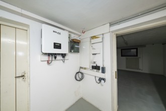 Technical room in the basement with Solax inverter and photovoltaic system installations, house
