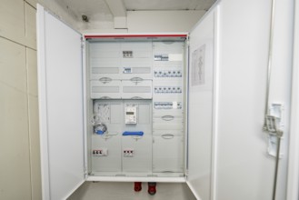 Detailed view of an opened fuse box with modular electrical distribution, house renovation,