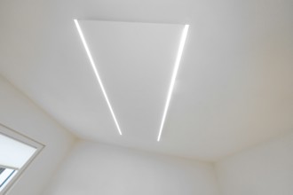 Bright ceiling with two parallel LED light strips, minimalistic design, house renovation, climate
