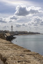 An old historic town. The skyline along the city beach and promenade shows its former glory. Cadiz