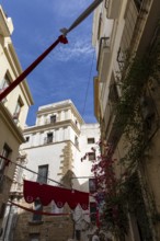 Street scene of a city, historic and Mediterranean. Nice old facades with balconies and narrow