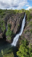 A waterfall and it´s pond in a remote are in Northern Territory Australia, photograped with a drone