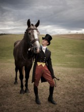 A rider from the Toronto North York Hunt Club, dressed in traditional hunting clothes and her