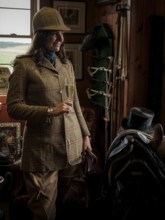 A rider from the Toronto North York Hunt Club, dressed in traditional hunting clothes, prepares