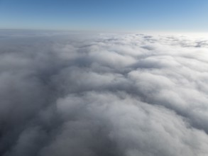 Aerial view, clouds of fog, fog cover seen from above, with clear blue sky, Germany