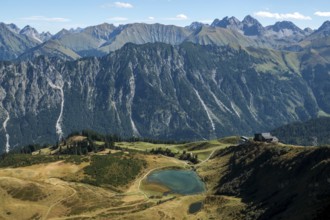 View from the Fellhorn Ridge hiking trail to Schlappoldsee and mountains of the Allgäu Alps,